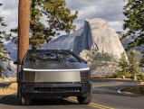 Tesla Cybertruck on a mountain road, blending advanced technology with rugged performance, ideal for businesses seeking tax-efficient vehicles.