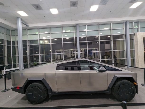 Detailed view of the Tesla Cybertruck in a showroom.