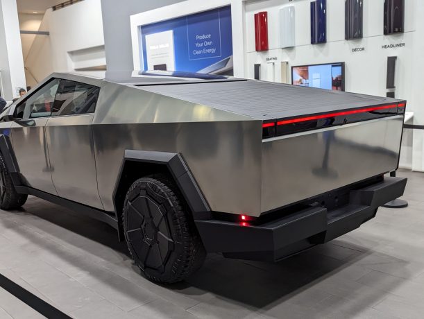 Tesla Cybertruck in a showroom, representing future potential.