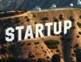 Hollywood sign transformed to read "STARTUP" against a scenic LA backdrop.