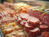 Assorted deli meats and cold cuts displayed in Jersey Mike's sandwich counter